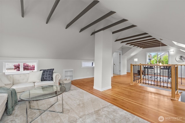 4528 36th Ave NE, Seattle, WA 98105 - living area featuring wood finished floors, plenty of natural light, and baseboards