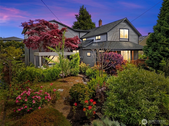 4528 36th Ave NE, Seattle, WA 98105 - view of front of property featuring roof with shingles and a chimney