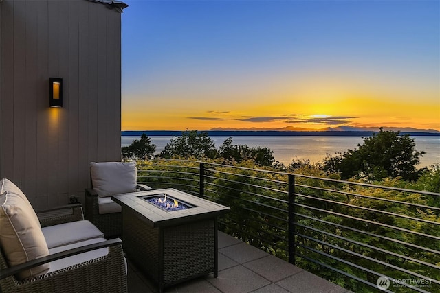20434 10th Pl SW, Normandy Park, WA 98166 - balcony at dusk with a fire pit and a water view