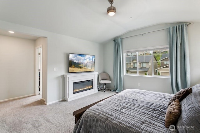 1134 Baker Heights Loop, Bremerton, WA 98312 - carpeted bedroom with vaulted ceiling, a glass covered fireplace, and baseboards