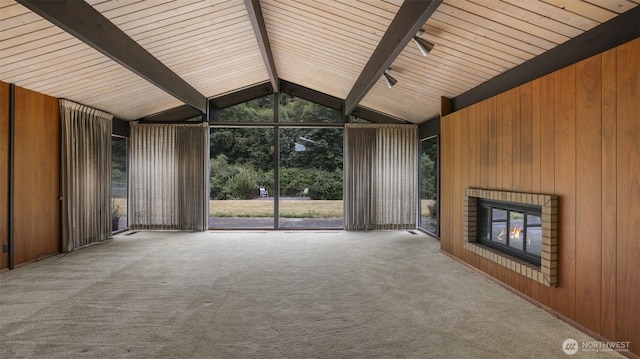 16 Riverview Dr NE, Auburn, WA 98002 - unfurnished living room featuring a fireplace, wooden walls, and carpet floors