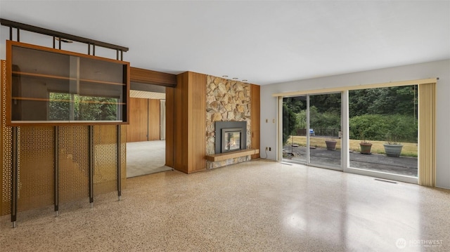 16 Riverview Dr NE, Auburn, WA 98002 - unfurnished living room featuring speckle patterned floor and a fireplace