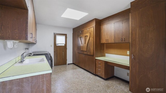 16 Riverview Dr NE, Auburn, WA 98002 - washroom featuring cabinet space, a skylight, and a desk