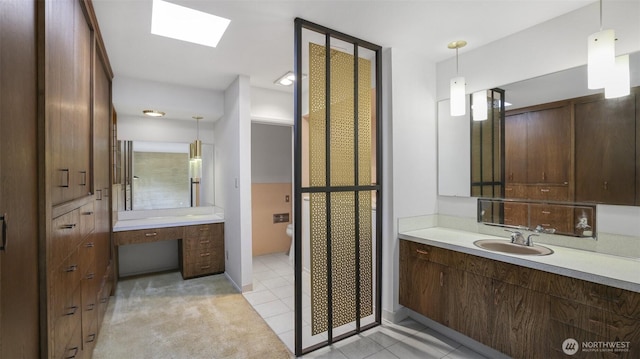 16 Riverview Dr NE, Auburn, WA 98002 - full bathroom featuring vanity, a skylight, and tile patterned flooring