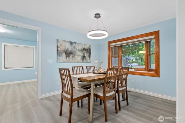 4530 240th St SW, Mountlake Terrace, WA 98043 - dining area with light wood-style flooring and baseboards