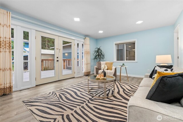 4530 240th St SW, Mountlake Terrace, WA 98043 - living area with french doors, wood finished floors, and baseboards