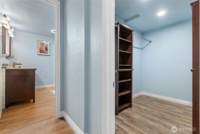 4530 240th St SW, Mountlake Terrace, WA 98043 - spacious closet featuring light wood-style flooring and attic access