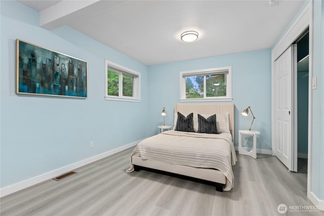 4530 240th St SW, Mountlake Terrace, WA 98043 - bedroom featuring wood finished floors, baseboards, a closet, and beam ceiling