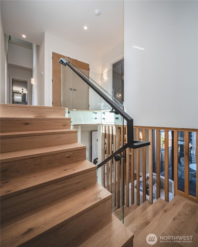 8004 39th Ave SW, Seattle, WA 98136 - staircase featuring wood finished floors and recessed lighting