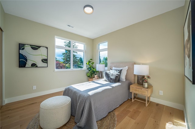 8004 39th Ave SW, Seattle, WA 98136 - bedroom with light wood-type flooring and baseboards
