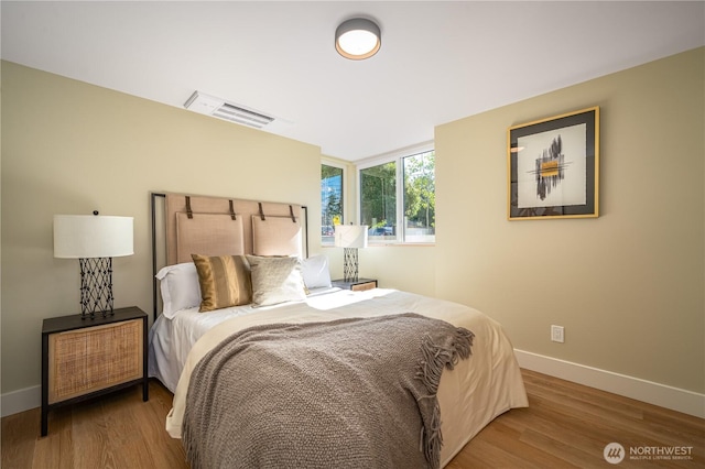 8004 39th Ave SW, Seattle, WA 98136 - bedroom with baseboards and wood finished floors