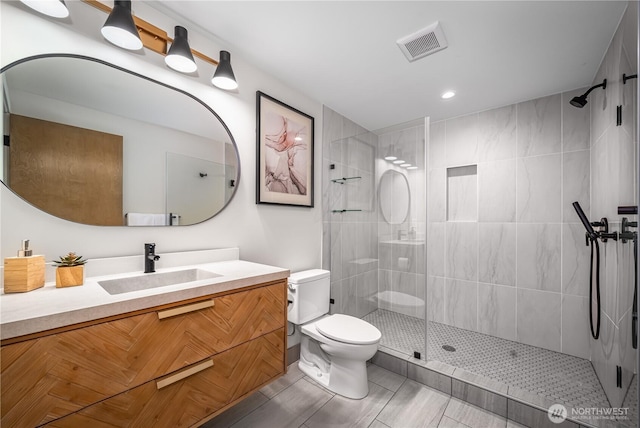 8004 39th Ave SW, Seattle, WA 98136 - bathroom with toilet, vanity, a tile shower, and recessed lighting