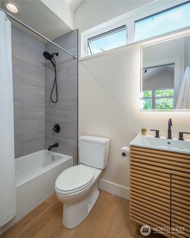 8004 39th Ave SW, Seattle, WA 98136 - full bathroom with toilet, shower / tub combo with curtain, wood finished floors, vanity, and baseboards