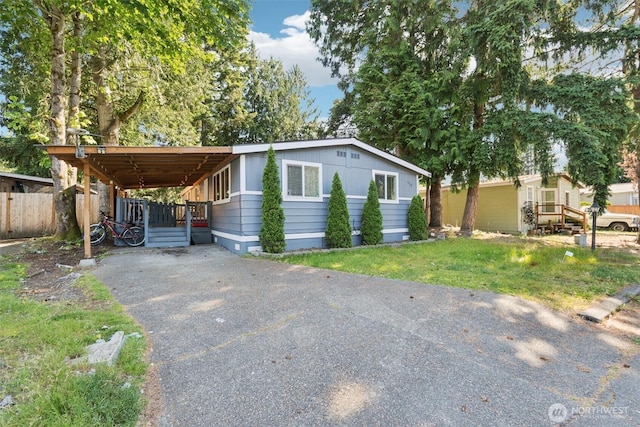 4248 A St SE Unit 518, Auburn, WA 98002 - manufactured / mobile home featuring asphalt driveway and a carport