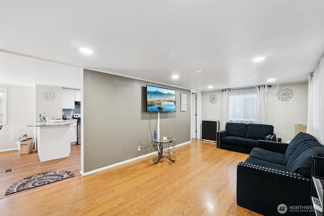 4248 A St SE Unit 518, Auburn, WA 98002 - living area with light wood finished floors, recessed lighting, and baseboards