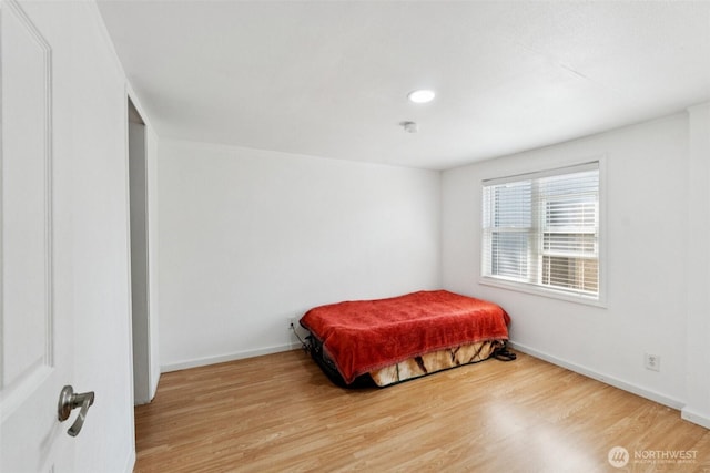 4248 A St SE Unit 518, Auburn, WA 98002 - bedroom with wood finished floors, baseboards, and recessed lighting