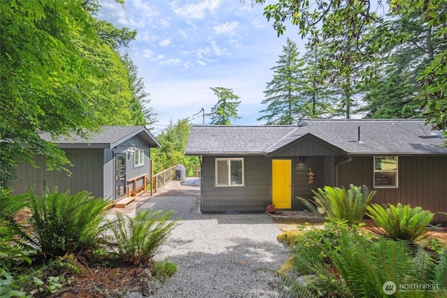 1188 Island Dr, Lummi Island, WA 98262 - view of front facade featuring driveway, an outbuilding, and a shingled roof