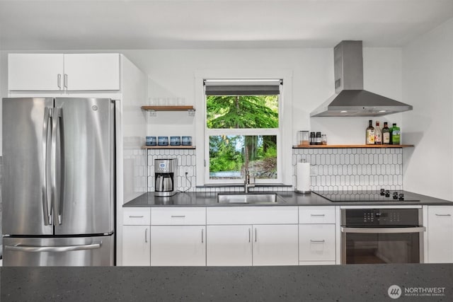 1188 Island Dr, Lummi Island, WA 98262 - kitchen featuring stainless steel appliances, open shelves, wall chimney range hood, and dark countertops