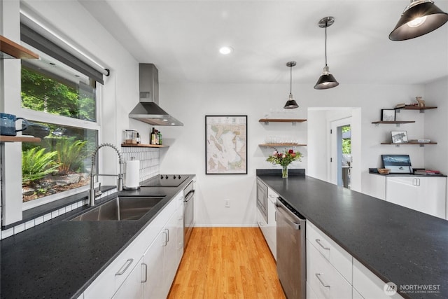 1188 Island Dr, Lummi Island, WA 98262 - kitchen featuring open shelves, a sink, wall chimney exhaust hood, appliances with stainless steel finishes, and white cabinets