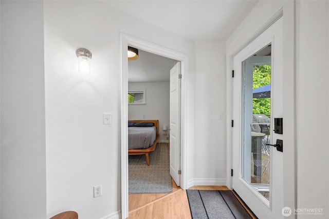 1188 Island Dr, Lummi Island, WA 98262 - corridor with light wood-style flooring, healthy amount of natural light, and baseboards