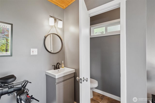 1188 Island Dr, Lummi Island, WA 98262 - bathroom featuring toilet, vanity, and tile patterned flooring