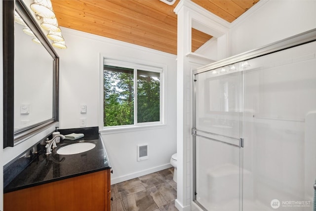 1188 Island Dr, Lummi Island, WA 98262 - full bath featuring vanity, a stall shower, toilet, baseboards, and heating unit