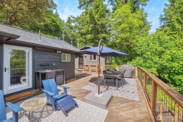 1188 Island Dr, Lummi Island, WA 98262 - wooden deck featuring outdoor dining space and area for grilling