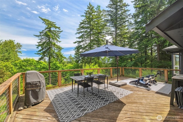 1188 Island Dr, Lummi Island, WA 98262 - wooden deck with outdoor dining space and area for grilling