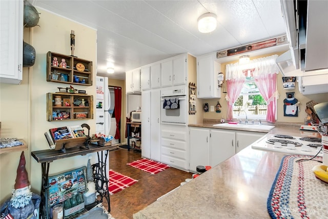 25513 37th Ave E, Spanaway, WA 98387 - kitchen featuring white appliances, a sink, white cabinetry, and light countertops