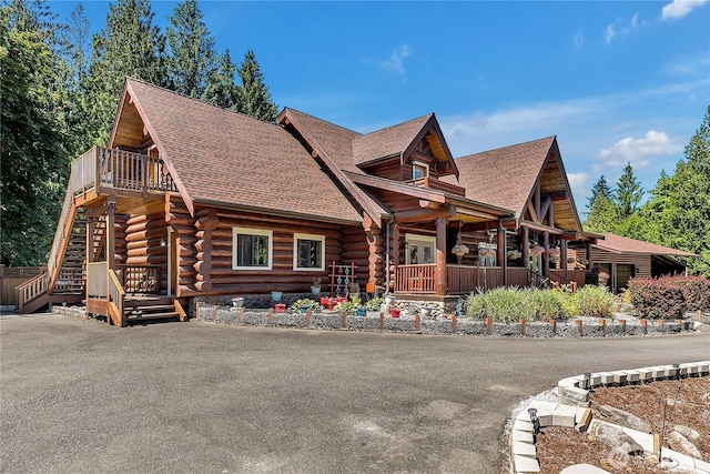 19219 SE 299th Pl, Kent, WA 98042 - log home featuring log exterior, a shingled roof, stairs, and a porch