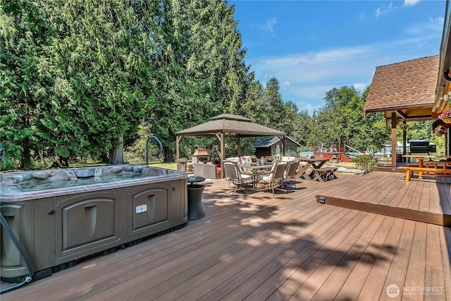 19219 SE 299th Pl, Kent, WA 98042 - wooden deck with outdoor dining area, a gazebo, a hot tub, and area for grilling