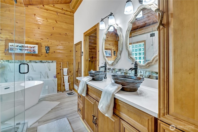 19219 SE 299th Pl, Kent, WA 98042 - bathroom with wooden walls, vanity, a freestanding bath, wood finished floors, and a stall shower