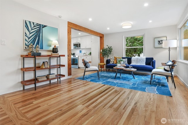 369 NW 49th St, Seattle, WA 98107 - living room featuring light wood finished floors, recessed lighting, and baseboards
