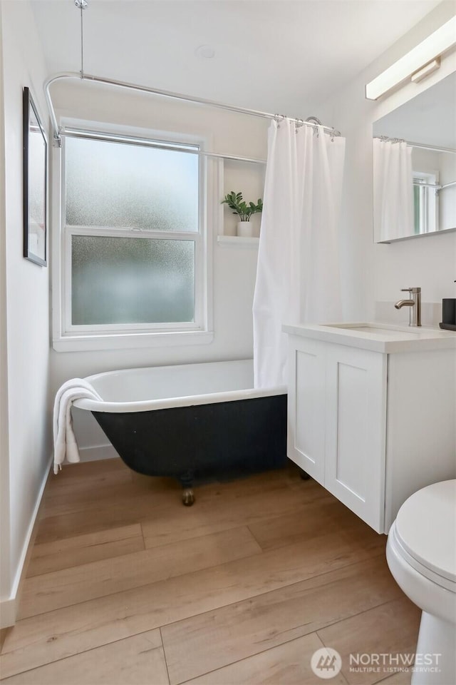 369 NW 49th St, Seattle, WA 98107 - full bathroom featuring wood finished floors, vanity, and toilet