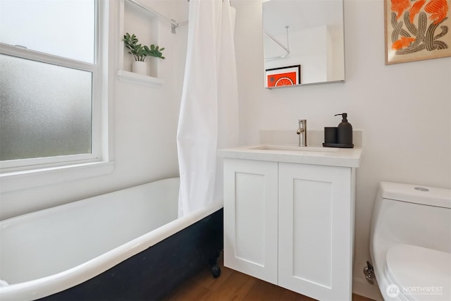 369 NW 49th St, Seattle, WA 98107 - bathroom featuring vanity, toilet, shower / bathtub combination with curtain, and wood finished floors