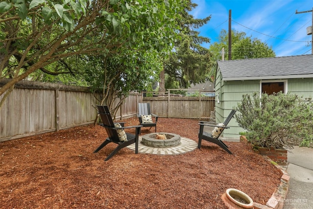 369 NW 49th St, Seattle, WA 98107 - fenced backyard featuring an outdoor fire pit