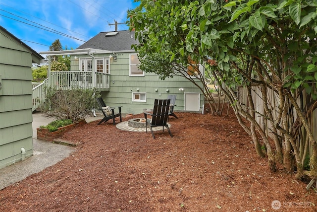 369 NW 49th St, Seattle, WA 98107 - back of property with a fire pit and a shingled roof