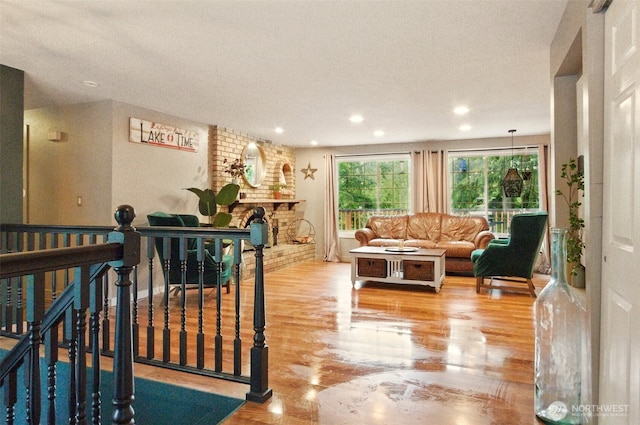 17521 25th Street Ct E, Lake Tapps, WA 98391 - living area featuring wood finished floors, recessed lighting, and a fireplace