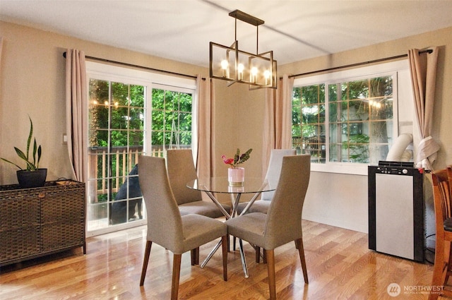 17521 25th Street Ct E, Lake Tapps, WA 98391 - dining area with a chandelier and wood finished floors