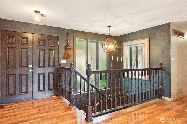 17521 25th Street Ct E, Lake Tapps, WA 98391 - entryway featuring wood finished floors, a chandelier, and baseboards