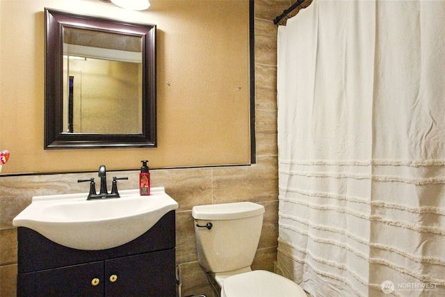 17521 25th Street Ct E, Lake Tapps, WA 98391 - bathroom with tile walls, vanity, toilet, and curtained shower