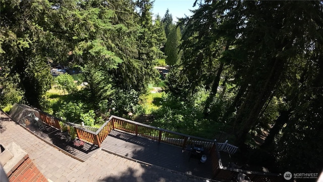 17521 25th Street Ct E, Lake Tapps, WA 98391 - view of patio / terrace with a wooden deck and a wooded view