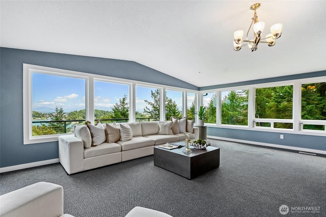 573 Klamath Dr, La Conner, WA 98257 - living room with vaulted ceiling, plenty of natural light, a chandelier, baseboards, and carpet flooring