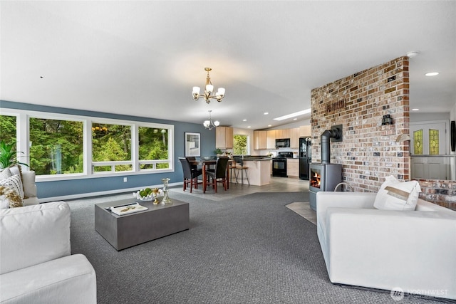573 Klamath Dr, La Conner, WA 98257 - living room featuring a chandelier, a wood stove, recessed lighting, carpet flooring, and baseboards
