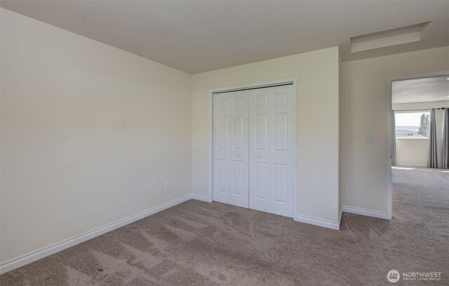 1718 Okanogan Ave, Wenatchee, WA 98801 - unfurnished bedroom with carpet flooring, baseboards, and a closet