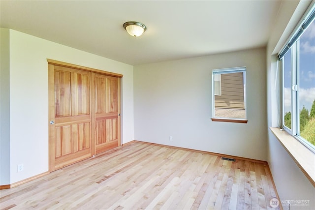19402 NE 68th Way, Redmond, WA 98052 - unfurnished bedroom featuring light wood finished floors and baseboards