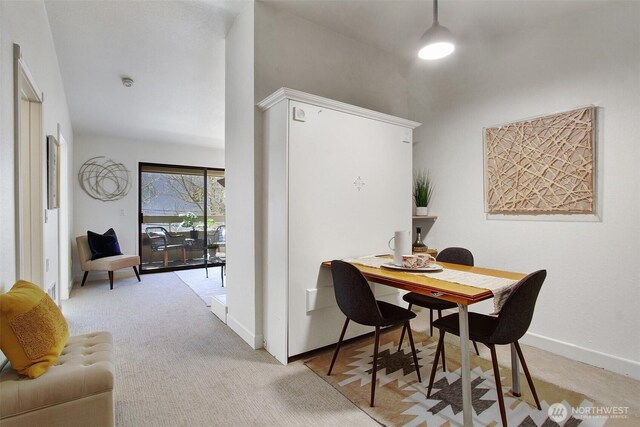 9512 1st Ave NE Unit 402, Seattle, WA 98115 - dining area featuring baseboards and light colored carpet