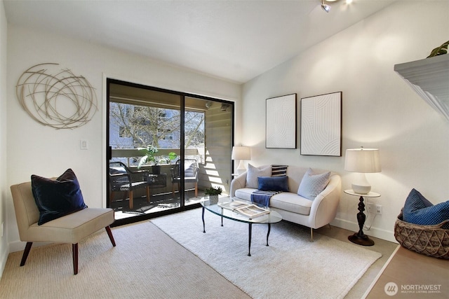 9512 1st Ave NE Unit 402, Seattle, WA 98115 - living area featuring baseboards