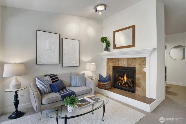 9512 1st Ave NE Unit 402, Seattle, WA 98115 - carpeted living room with baseboards and a fireplace