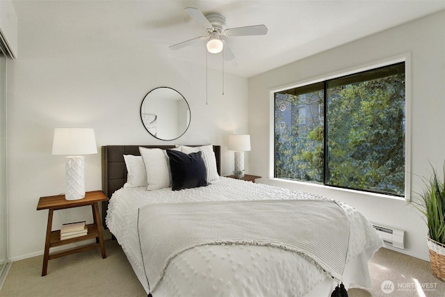 9512 1st Ave NE Unit 402, Seattle, WA 98115 - carpeted bedroom featuring baseboards and ceiling fan